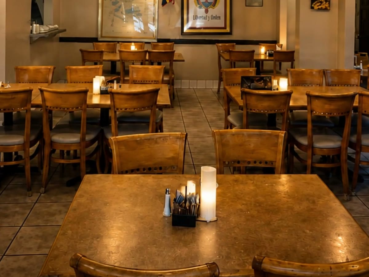 Candle-lit wooden tables and leather-backed chairs