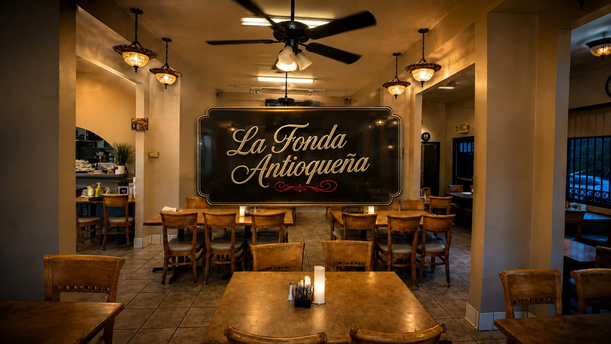 The La Fonda Antioqueña placard glowing inside the dining room